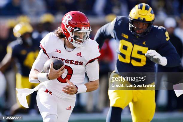 Rutgers Scarlet Knights quarterback Noah Vedral runs with the ball against the Michigan Wolverines during a college football game on Sept. 25, 2021...