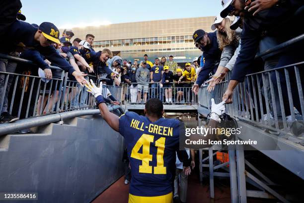 Michigan Wolverines linebacker Nikhai Hill-Green celebrates with fans following a college football game against the Rutgers Scarlet Knights on Sept....