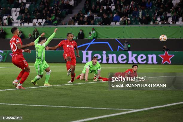 Wolfsburg's Swiss midfielder Renato Steffen scores the team's first goal during the UEFA Champions League Group G football match between VfL...