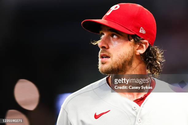 Aaron Nola of the Philadelphia Phillies looks on while walking off the field after giving up 2 runs in the first inning of game 2 in a series between...