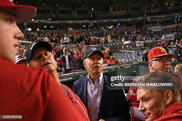 President Joe Biden watches the Congressional Baseball Game from the Republicans dugout at Nationals Park in Washington, DC on September 29, 2021. -...