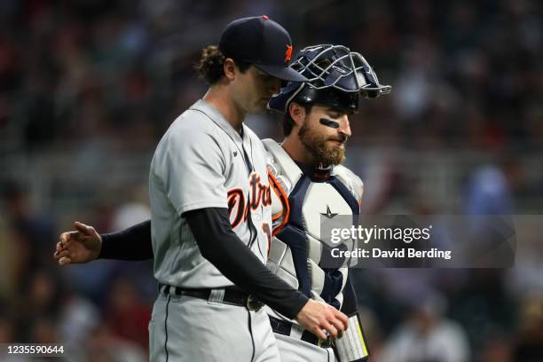 Casey Mize, left, and Eric Haase of the Detroit Tigers walk to the dugout after the first inning at Target Field on September 29, 2021 in...