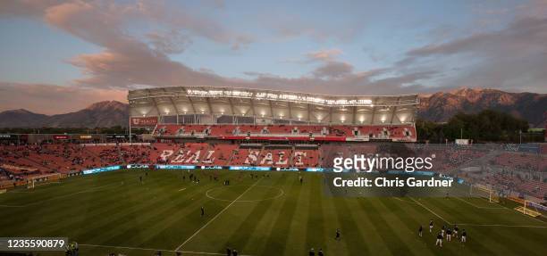 The sun sets against the Wasatch Mountains as members of Real Salt Lake and the Los Angeles Galaxy warm up before their game September 29, 2021 at...