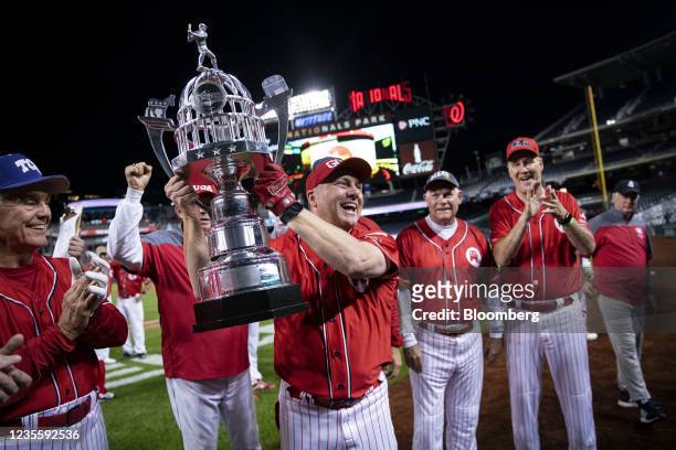 House Minority Whip Steve Scalise, a Republican from Louisiana, holds the trophy following the Republicans 13-12 victory of the Congressional...