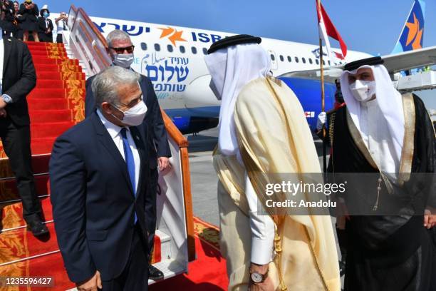 Israeli Foreign Minister Yair Lapid being welcomed by Bahraini Foreign Minister Abdullatif bin Rashid Al Zayani at Manama airport during his first...