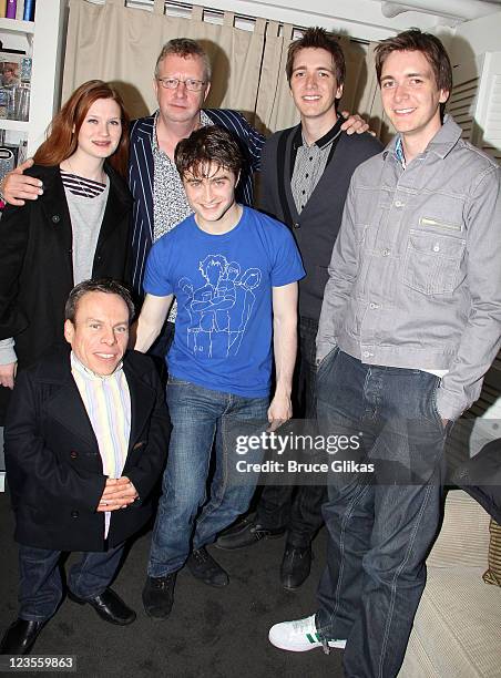 Bonnie Wright, Warwick Davis, Mark Williams, Daniel Radcliffe, James Phelps and Oliver Phelps pose backstage at the hit musical "How to Succeed in...