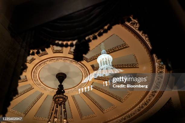 The U.S. Capitol dome reflected at the Ohio Clock Corridor in Washington, D.C., U.S., on Thursday, Sept. 30, 2021. President Biden is poised to avoid...