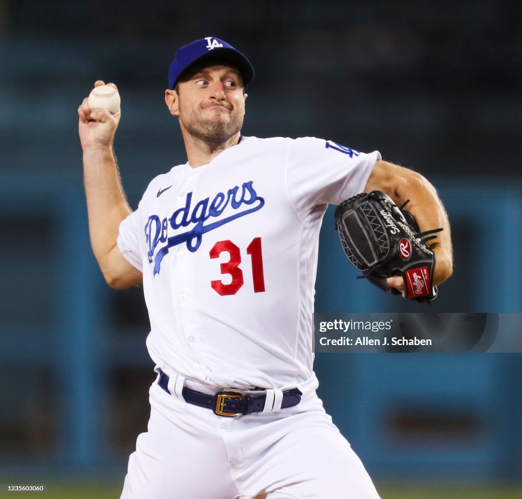 Max's Pitcher Dodgers starting pitcher Max Scherzer delivers a pitch against the ...