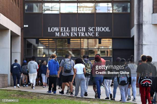 Lowell, MA Students entering Lowell High School in Lowell, MA on September 27, 2021. Lowell is the 3rd largest school in Massachusetts.