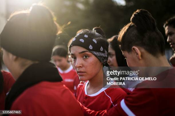 Players of Afghanistan national women football team attend to a training session at Odivelas, outskirts of Lisbon on September 30, 2021. - Forced to...
