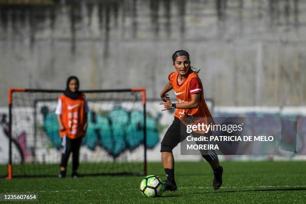 Players of Afghanistan national women football team attend to a training session at Odivelas, outskirts of Lisbon on September 30, 2021. - Forced to...