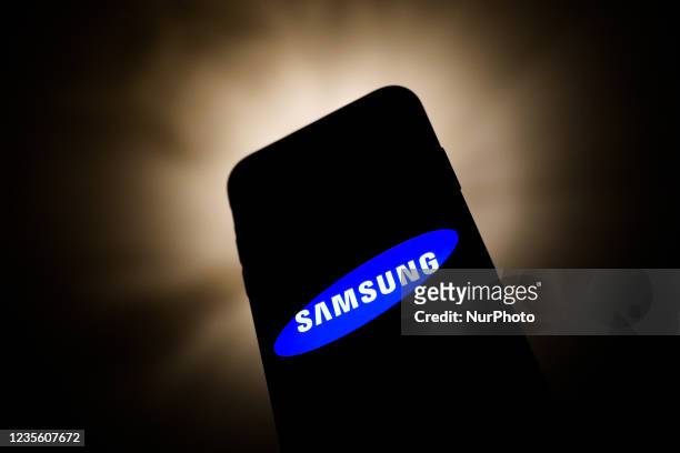 Samsung logo displayed on a phone screen is seen in this illustration photo taken in Krakow, Poland on September 30, 2021.
