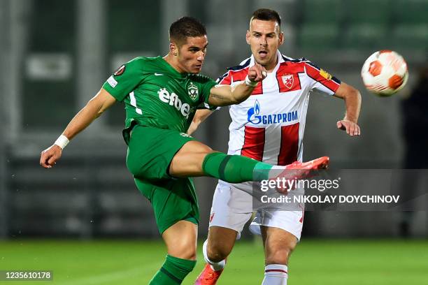 Ludogorets Razgrad's forward Pieros Sotiriou kicks the ball past Crvena Zvezda Beograd's Serbian defender Marko Gobeljic during the UEFA Europa...