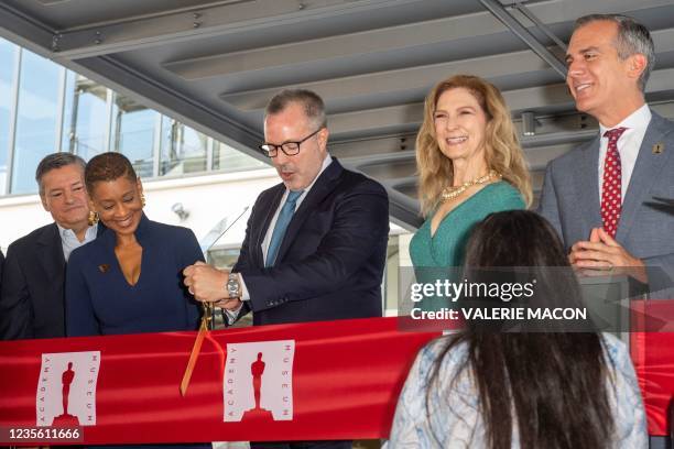 Director and president of the Academy Museum Bill Kramer cuts the ribbon at the Dedication Ceremony and Official Ribbon-Cutting for the Opening of...