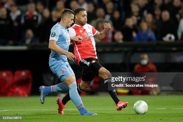 Tomas Holes of Slavia Prague, Cyriel Dessers of Feyenoord during the Conference League match between Feyenoord v Slavia Prague at the Stadium...