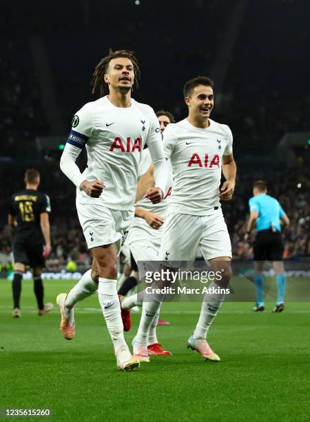 Dele Alli of Tottenham Hotspur celebrates scoring the opening goal from the penalty spot with Sergio Reguilon during the UEFA Europa Conference...