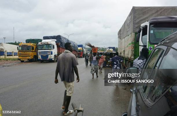 Truck are seen stationary at the customs in Noe, a border town between Ivory Coast and Ghana where residents have not been able to cross due to the...
