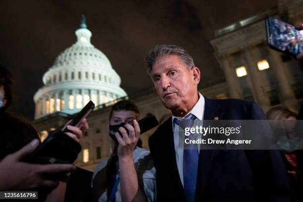 Sen. Joe Manchin and Director of the U.S. Domestic Policy Council Susan Rice exit a closed-door meeting at the U.S. Capitol on September 30, 2021 in...