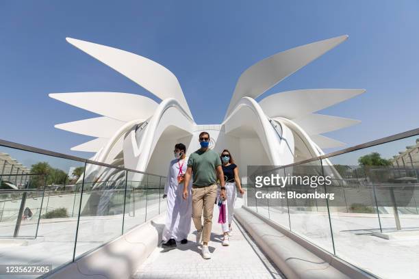 Visitors exit the United Arab Emirates pavilion during the opening day of the Expo 2020 exhibition in Dubai, United Arab Emirates, on Friday, Oct. 1,...