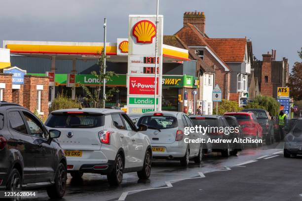 As the fuel crisis in the UK continues, this Shell petrol station is open for business as usual, motorists arrive in with their cars to fill up with...