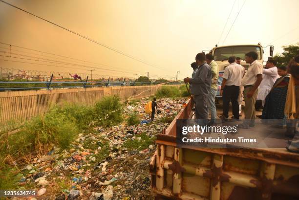 East Delhi Municipal Corporation employees can be seen spraying the insecticides from the Mosquito Terminator Train along the railway tracks to...