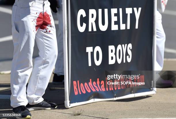 Banner saying, cruelty to boys, during the demonstration. A group of men and women from around the country are on a two-week protest across...