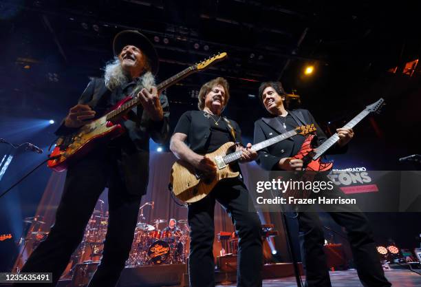 In this image released on October 1 Patrick Simmons, Tom Johnston, and John McFee of The Doobie Brothers perform live onstage at iHeartRadio ICONS...