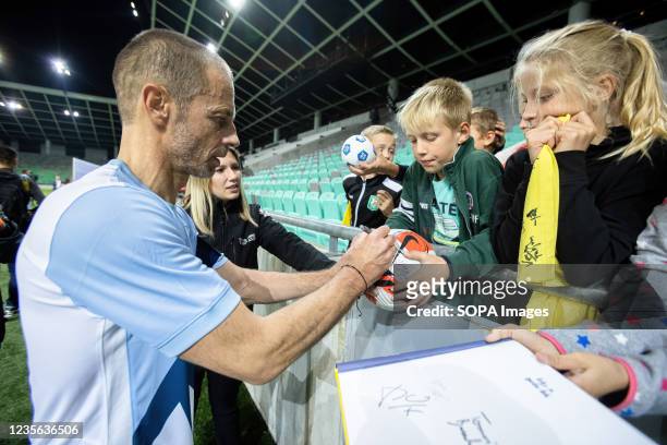 Aleksander Ceferin, President of The Union of European Football Associations, signs autographs for children at a charity football match in Ljubljana....