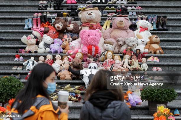 Toys and shoes are seen placed on the steps at a commemoration event during the first National Day for Truth and Reconciliation in Vancouver, British...