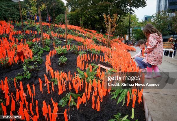 Orange ribbons are seen at a commemoration event during the first National Day for Truth and Reconciliation in Vancouver, British Columbia, Canada,...