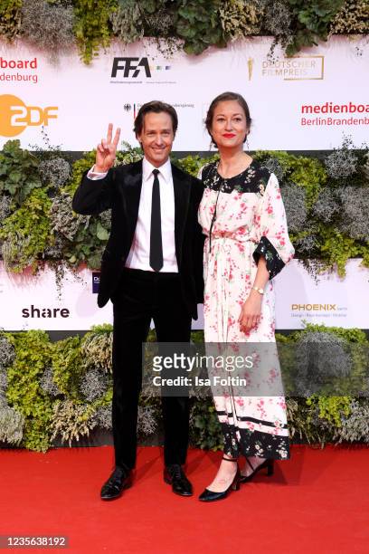 German actor Tom Schilling and his partner Annie Mosebach attend the Lola - German Film Award red carpet at Palais am Funkturm on October 1, 2021 in...