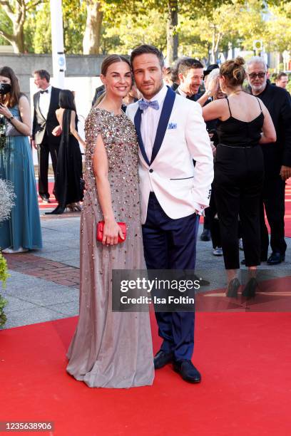 Annika Lau and German actor Frederick Lau attend the Lola - German Film Award red carpet at Palais am Funkturm on October 1, 2021 in Berlin, Germany.