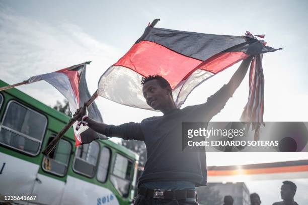Street vendor sells flags and merchandises depicting the Oromo regional colours in the streets of the city of Bishoftu, on October 2 thanksgiving...