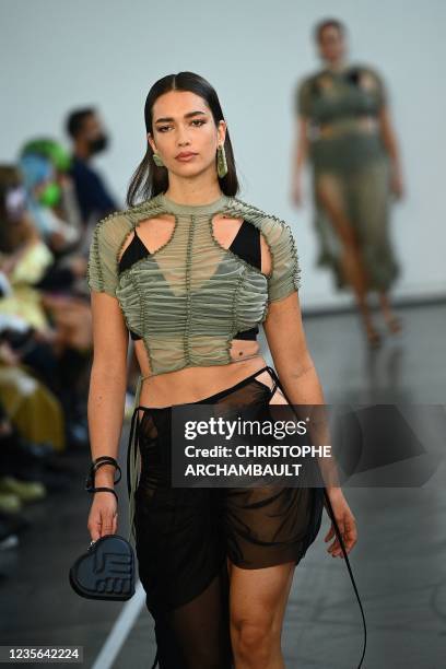 Model presents a creation by Ester Manas during the Women's Spring-Summer 2022 Ready-to-Wear collection fashion show in Paris, as part of the Paris...