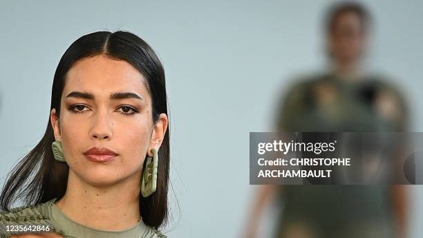Model presents a creation by Ester Manas during the Women's Spring-Summer 2022 Ready-to-Wear collection fashion show in Paris, as part of the Paris...