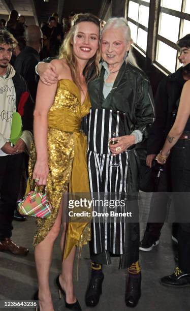 Georgia May Jagger and Dame Vivienne Westwood pose backstage at the Vivienne Westwood show during Paris Fashion Week Womenswear Spring Summer 2022 on...