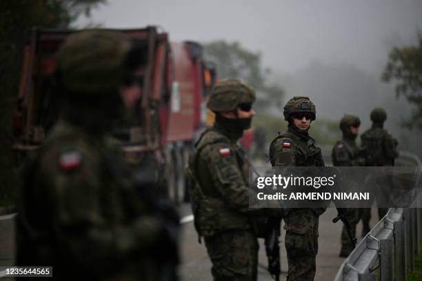 Soldiers patrol near the border between Kosovo and Serbia in Jarinje on October 2, 2021 as Serbs remove trucks and cars that used to block the border...