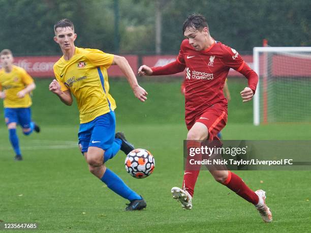 Luke Chambers of Liverpool and Will Dowling of Sunderland in action at AXA Training Centre on October 2, 2021 in Kirkby, England.