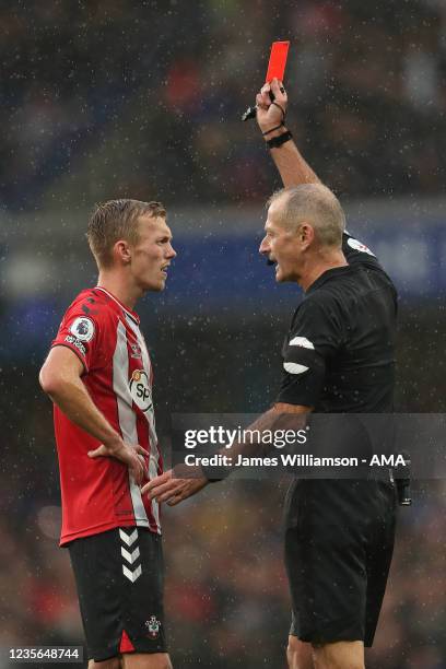 James Ward-Prowse of Southampton is shown a red card by Match referee Martin Atkinson after a VAR check during the Premier League match between...