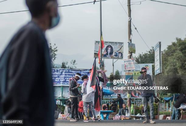 Street vendors sell flags and merchandises depicting the Oromo regional colours in the streets of the city of Bishoftu, on October 2 thanksgiving...