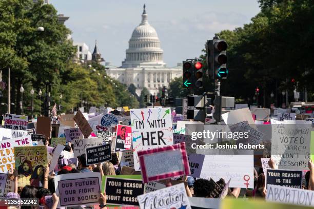 Women rights activists march to the U.S. Capitol during the annual Womens March October 2, 2021 in Washington, DC. The Women's March and other groups...