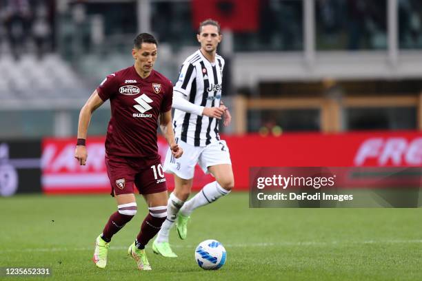 Sasa Lukic of Torino FC controls the ball during the Serie A match between Torino FC and Juventus at Stadio Olimpico di Torino on October 1, 2021 in...