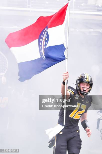 Missouri Tigers quarterback Brady Cook leads the team onto the field during a game between the Tennessee Volunteers and the Missouri Tigers on...