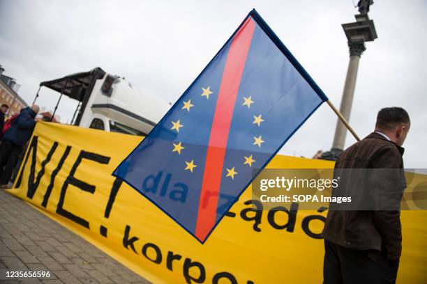 Protester holds a crossed out European Union flag during the demonstration. Hundreds of people took part in the annual March of Freedom and...
