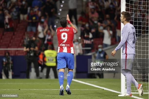 Luis Suarez of Atletico Madrid celebrates after scoring a goal during the La Liga week 8 soccer match between Atletico Madrid and Barcelona at the...