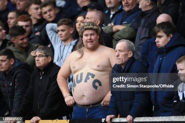 Newcastle United fan with a tattoo on his large belly seen during the Premier League match between Wolverhampton Wanderers and Newcastle United at...