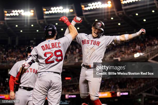 Enrique Hernandez of the Boston Red Sox reacts with Bobby Dalbec after hitting a two-run home run during the ninth inning of a game against the...