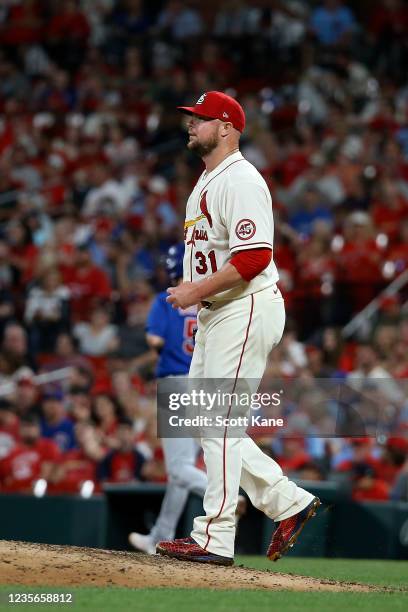 Jon Lester of the St. Louis Cardinals returns to the mound after walking Matt Duffy of the Chicago Cubs to load the bases during the fifth inning at...