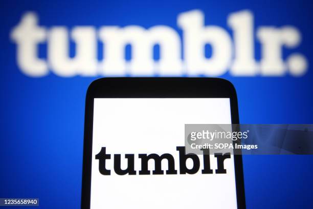 In this photo illustration a Tumblr logo of a microblogging and social networking website is seen on a smartphone and a pc screen.