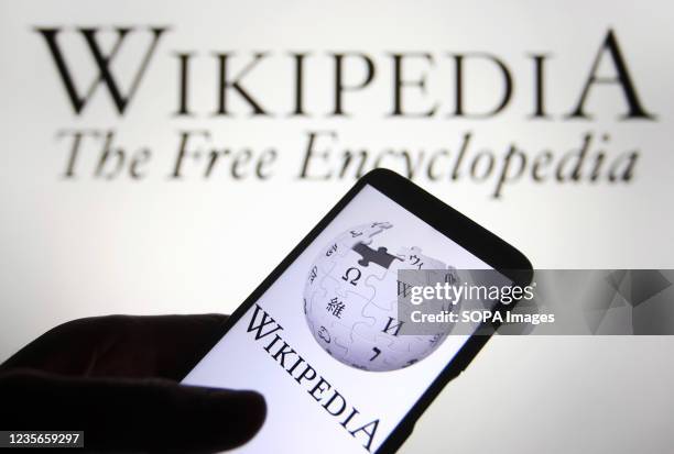 In this photo illustration a Wikipedia logo is seen on a smartphone.